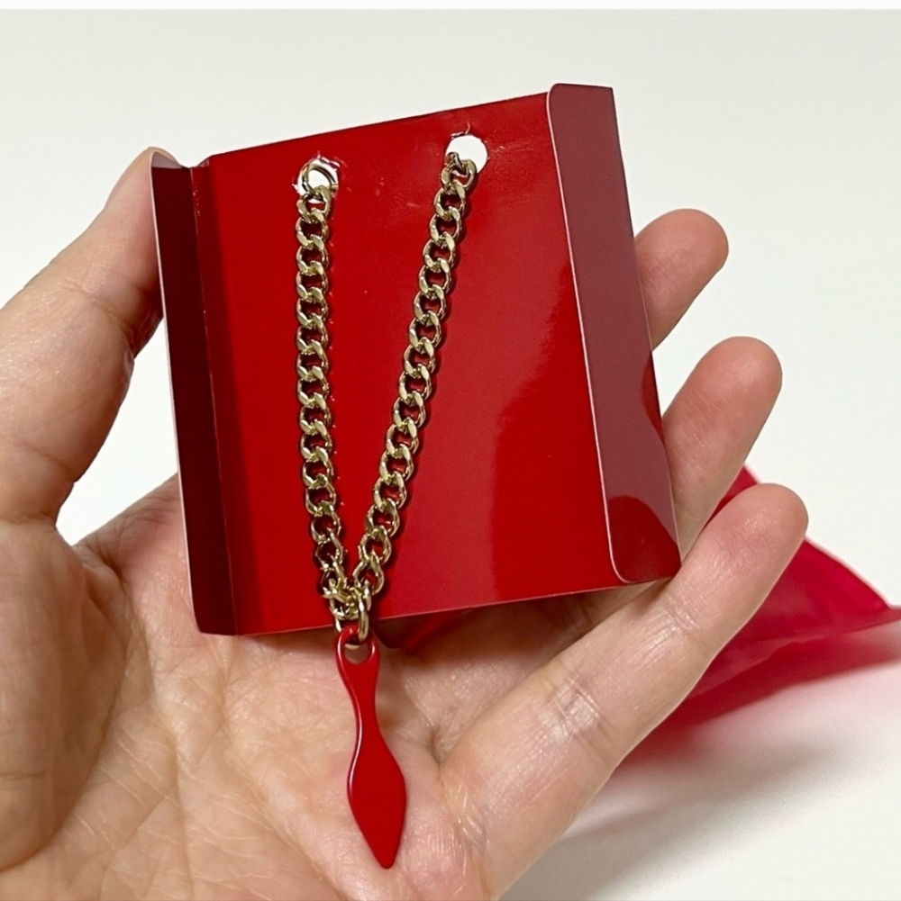 Christian Louboutin Red Bottom Shoe Charm On Gold Toned Chain. Multiple uses